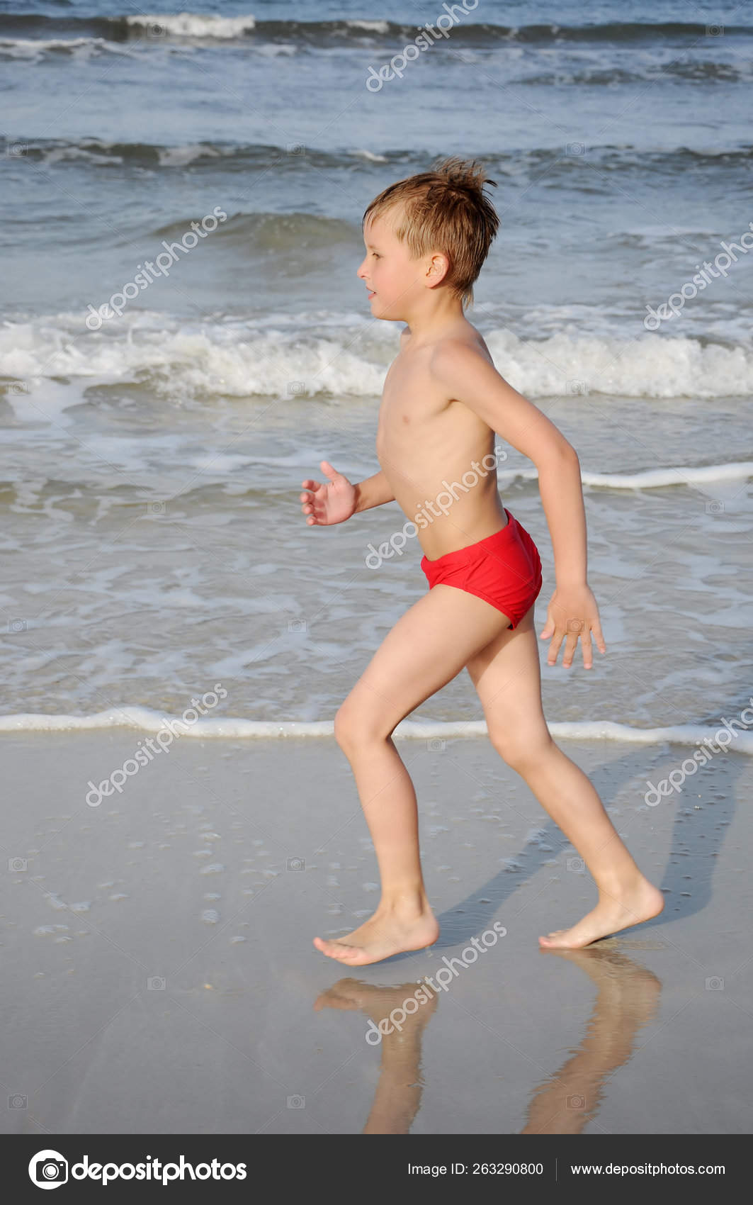 Boy Running Beach Sand — Stock Photo © YAYImages #263290800
