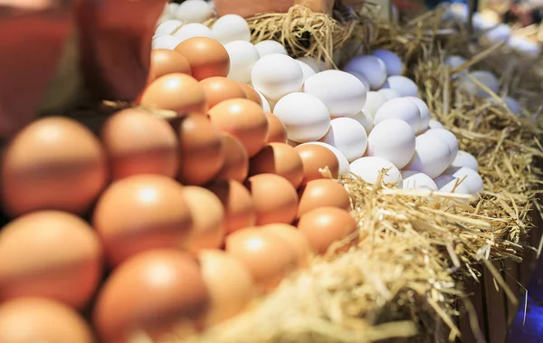 White and brown eggs in a  market