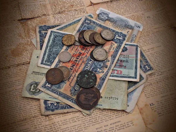 Old British currency notes and coins