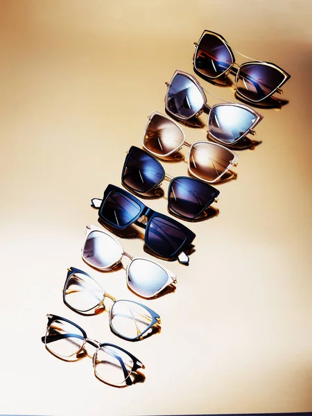 Glasses Few Elite Sunglasses Modern Fashionable Frame Gold Background — Stock Photo, Image