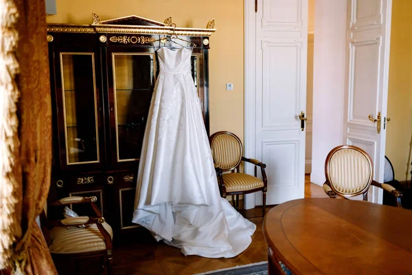 bridesmaid dress hanging on the closet