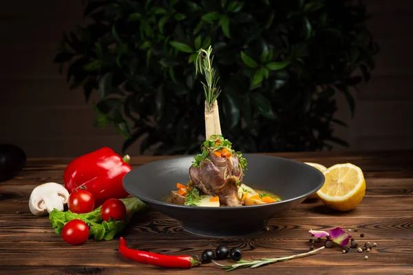baked lamb shank with oriental herbs and vegetables