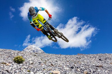 free descent with mtb in the mountains clipart