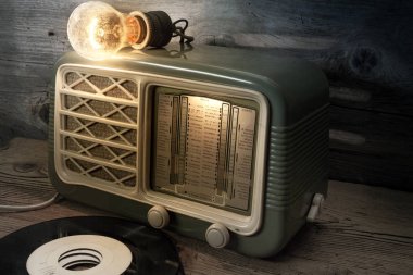 old radio with vinyl records clipart