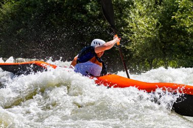 kayaking competition in the river with rapids clipart