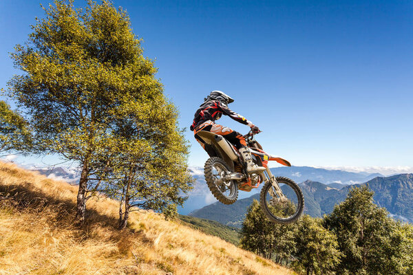 jump with a cross-country bike in the high mountains