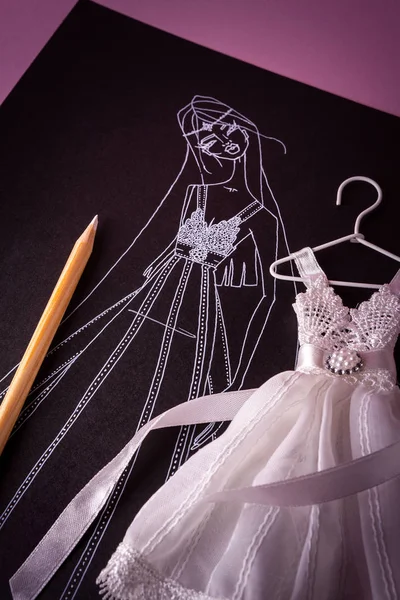 Sketch for wedding dress with miniature model