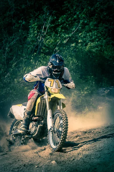 motorcyclist on dirt track