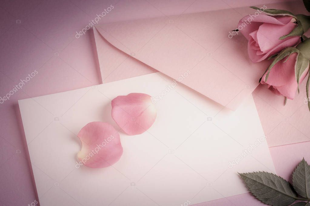 letter with pink envelope and rosebud