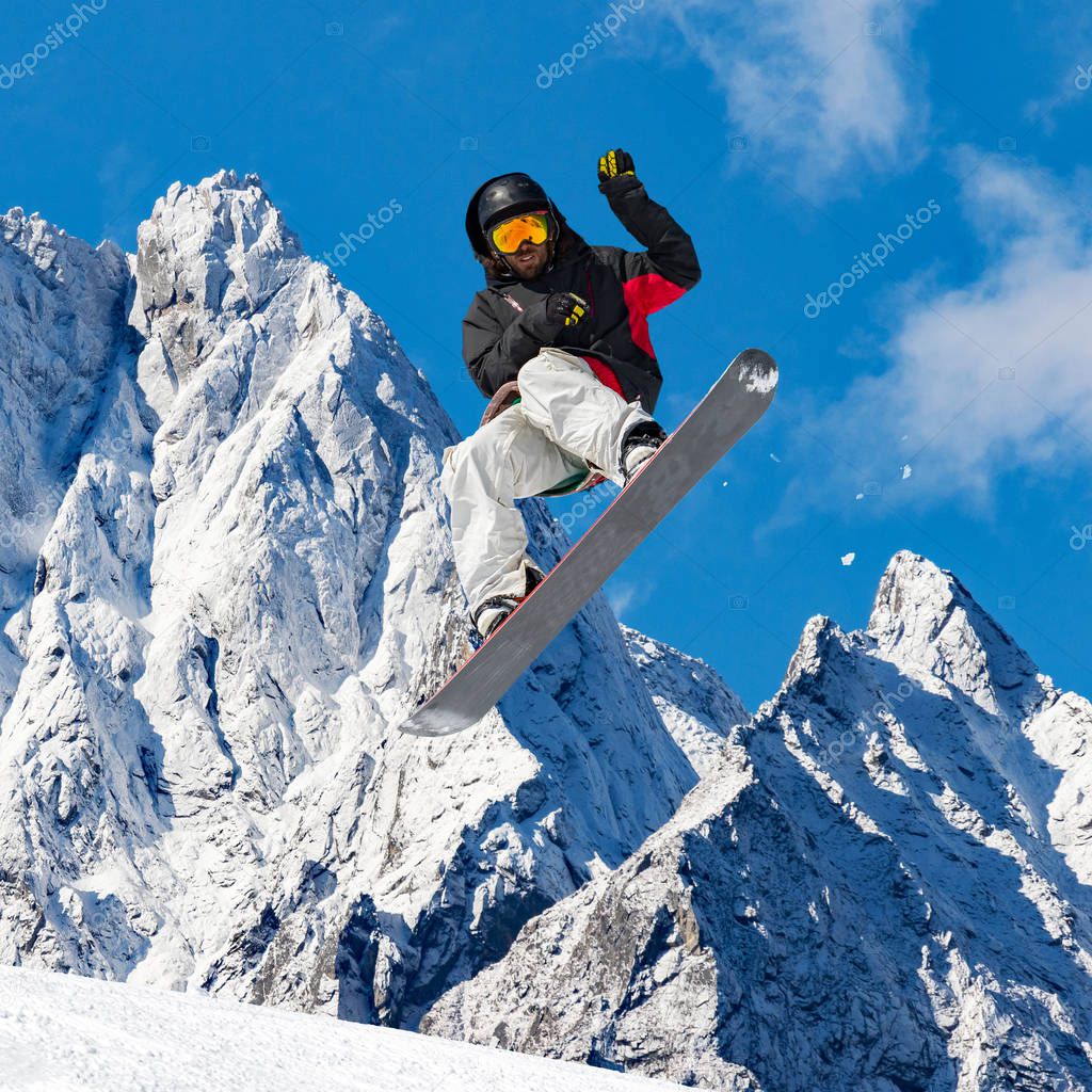 snowboard jump in alpine landscape