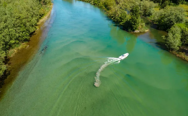 White inflatable boat - aerial view on river