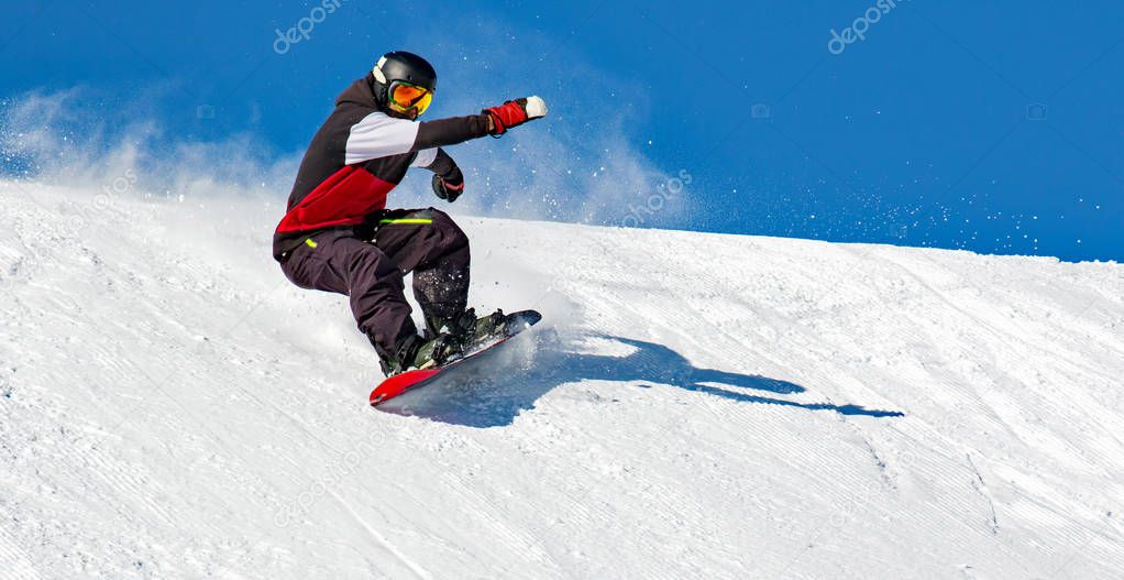 Snowboarder in action on the track with fresh snow