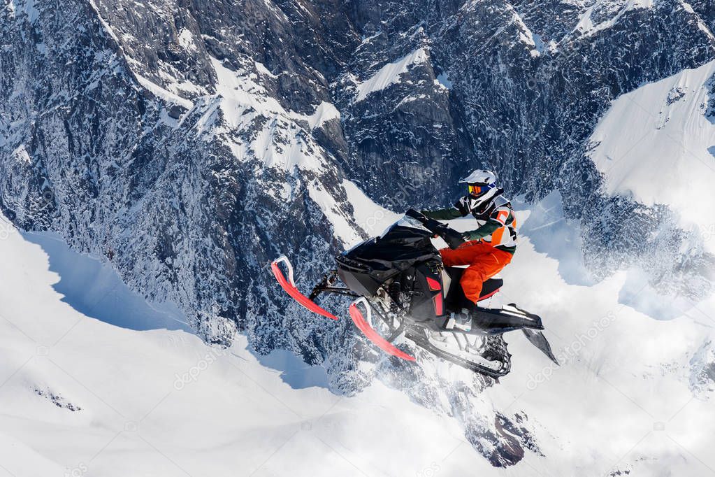 snowmobile jump in the alpine environment