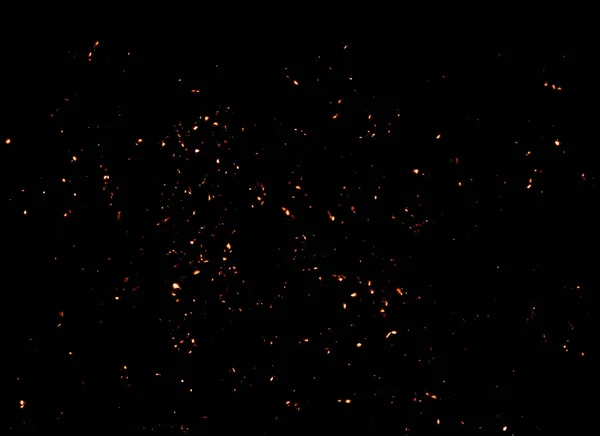 オーバーレイ デザインや画面のブレンドの Textire 黒背景に分離されたキャンプファイヤーから来た火の火花 — ストック写真