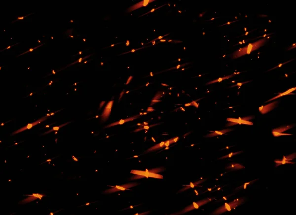 火的火花飞起来 在深色背景文本上发光的粒子 用于文本或空间 — 图库照片