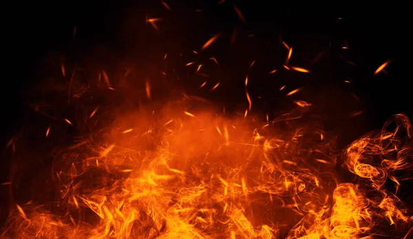 粒子残り火で焼く火のテクスチャ 分離の黒い背景に炎 バナー チラシ カードのためのテクスチャ — ストック写真