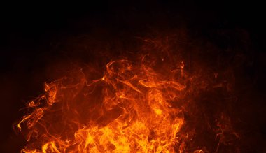 Texture of burn fire with particles embers. Flames on isolated black background. Texture for banner,flyer,card clipart