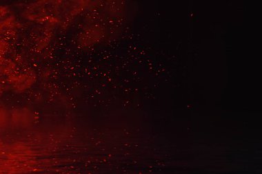 Parçacıklar köz yansıması su ile ateş. Afiş, el ilanı, kart için tasarım dokusu.