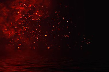 Parçacıklar köz yansıması su ile ateş. Afiş, el ilanı, kart için tasarım dokusu.