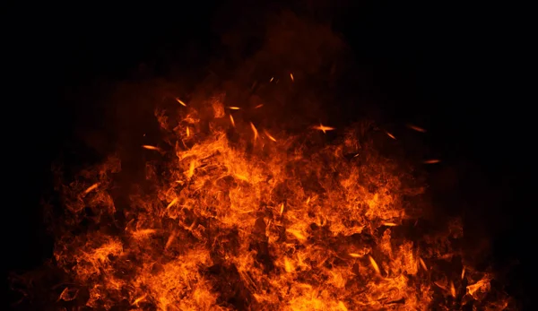 Feuer, Hitze, Leidenschaft, Textur. Brandpartikel glühen im Hintergrund. Gestaltungselement. — Stockfoto