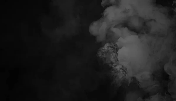 Smoke on the floor . Isolated black background . Misty fog effect texture for text or space