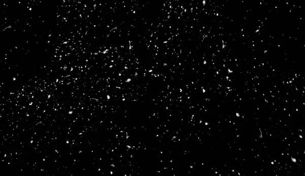 Primeira queda de textura bokeh neve no fundo preto. Textura de inverno . — Fotografia de Stock