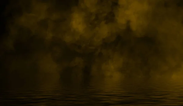 Yellow rolling billows of smoke mist from dry ice across the bottom light with reflection in water. — Stock Photo, Image