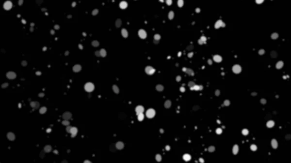 Замораживание движения белого снега снижается, изолированные на черном фоне . — стоковое фото