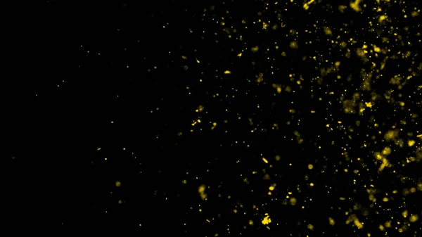 Partículas amarelas efeito poeira detritos isolados no fundo preto, movimento pulverização em pó explosão na textura escura — Fotografia de Stock