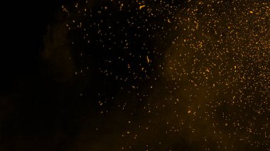 Arka planda mükemmel sarı parçacıklar közler . Doku kaplamaları. Tasarım öğesi.