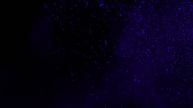 Mavi parçacıklar siyah arka plan üzerinde izole toz enkaz etkisi, hareket tozu sprey patlaması.