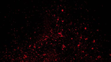 Kırmızı parçacıklar siyah arka plan, hareket tozu sprey patlama doku izole toz enkaz etkisi.