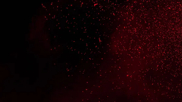 Rode deeltjes effect stof vuil geïsoleerd op zwarte achtergrond, Motion powder spray burst textuur. — Stockfoto