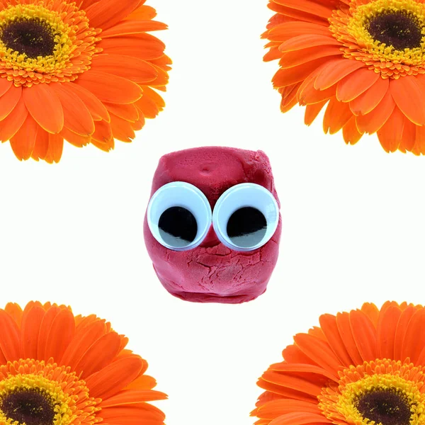 cute dough toy with flower on background