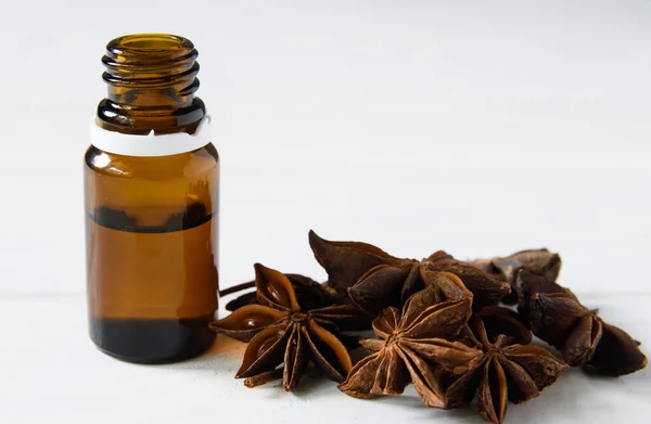 Anise and pharmaceutical bottle with a cover. Isolated on white background. close-up — Stock Photo, Image