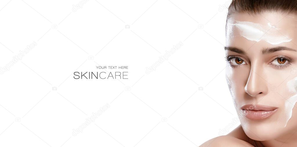 Beauty and skincare concept. Beautiful natural young woman face with cream on a healthy fresh clean skin. Cosmetology spa and skin care panorama banner isolated on white