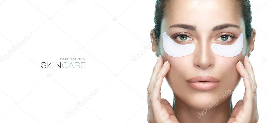 Eye care cosmetic mask. Beautiful woman with healthy fresh skin using patches under eyes. Beauty and eye skin care banner. Eye skin rejuvenation treatment. Isolated on white background with copy space