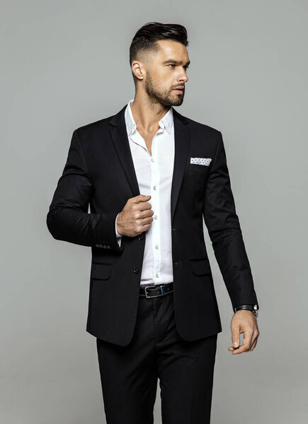 Portrait of handsome man in black suit