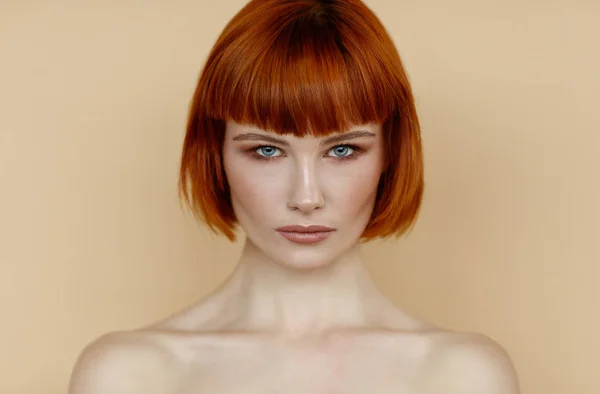 Portrait of female woman with red hair and natural skin texture