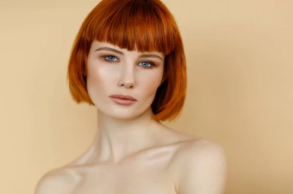 Portrait of female woman with red hair and natural skin texture