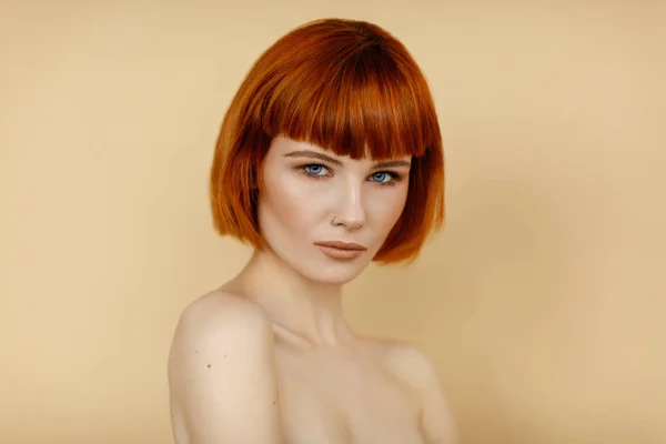 Portrait of female woman with red hair and natural skin texture