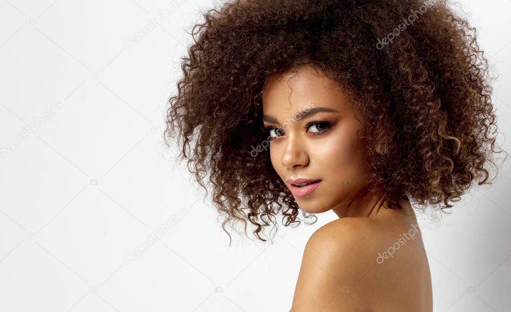 Portrait of young african american woman looking at camera isolated on white background