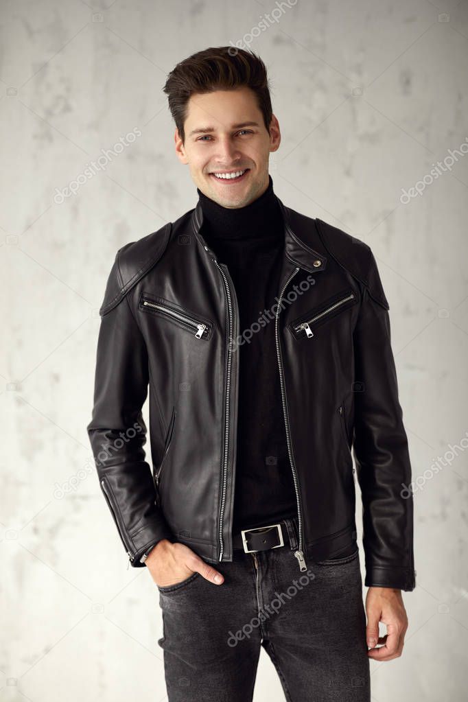 Handsome man in black outfit smiling