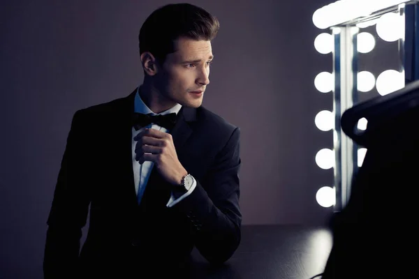 Sexy Man Black Suit Looking Mirror Wardrobe — Stock Photo, Image