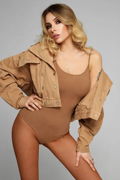 Fashion photo of young blonde woman wear denim jacket isolated o — Stock Photo, Image