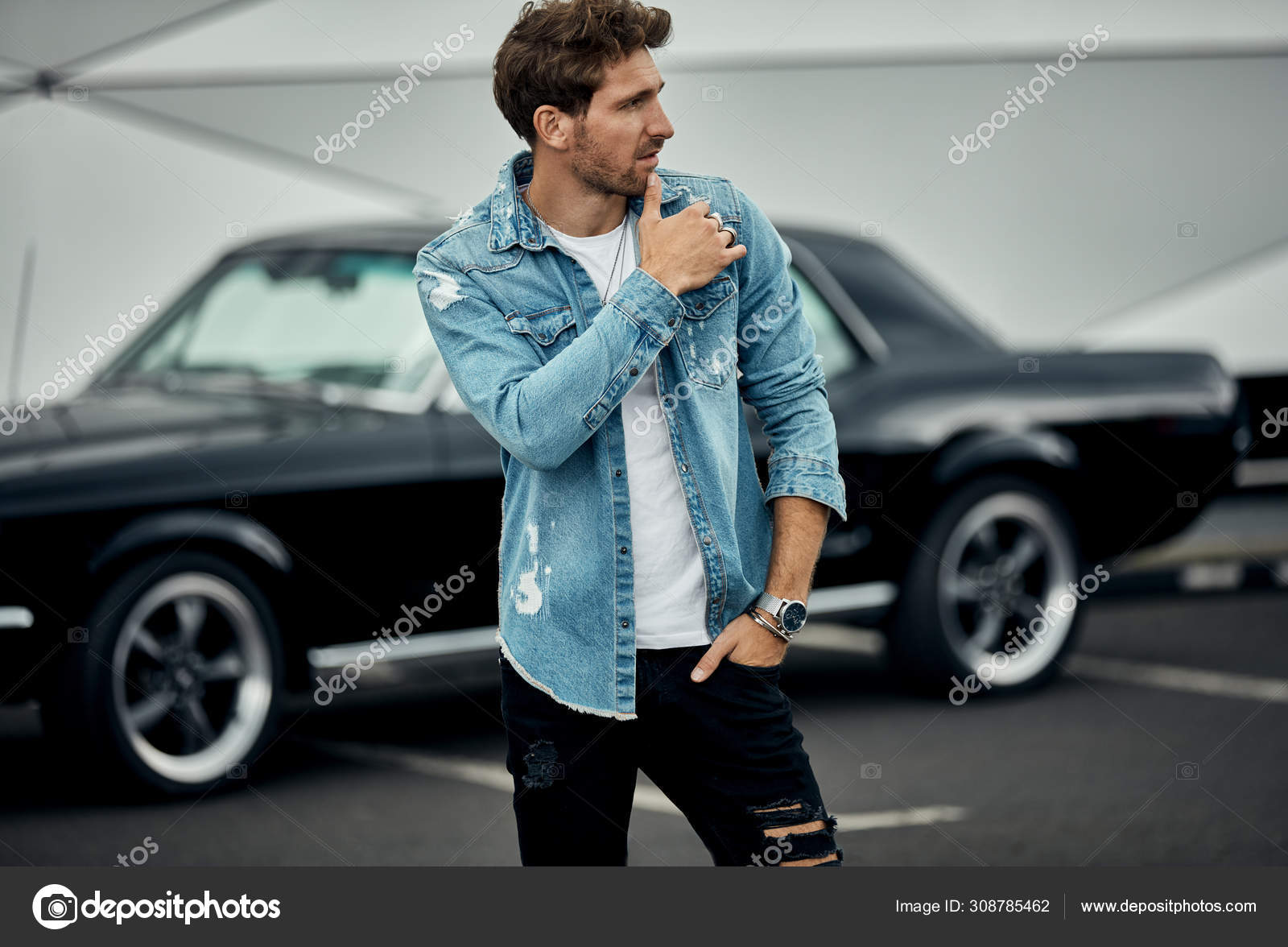 Handsome Stylish Man In Sunglasses Posing Near Car And Looking At Camera  Stock Photo, Picture and Royalty Free Image. Image 128145889.