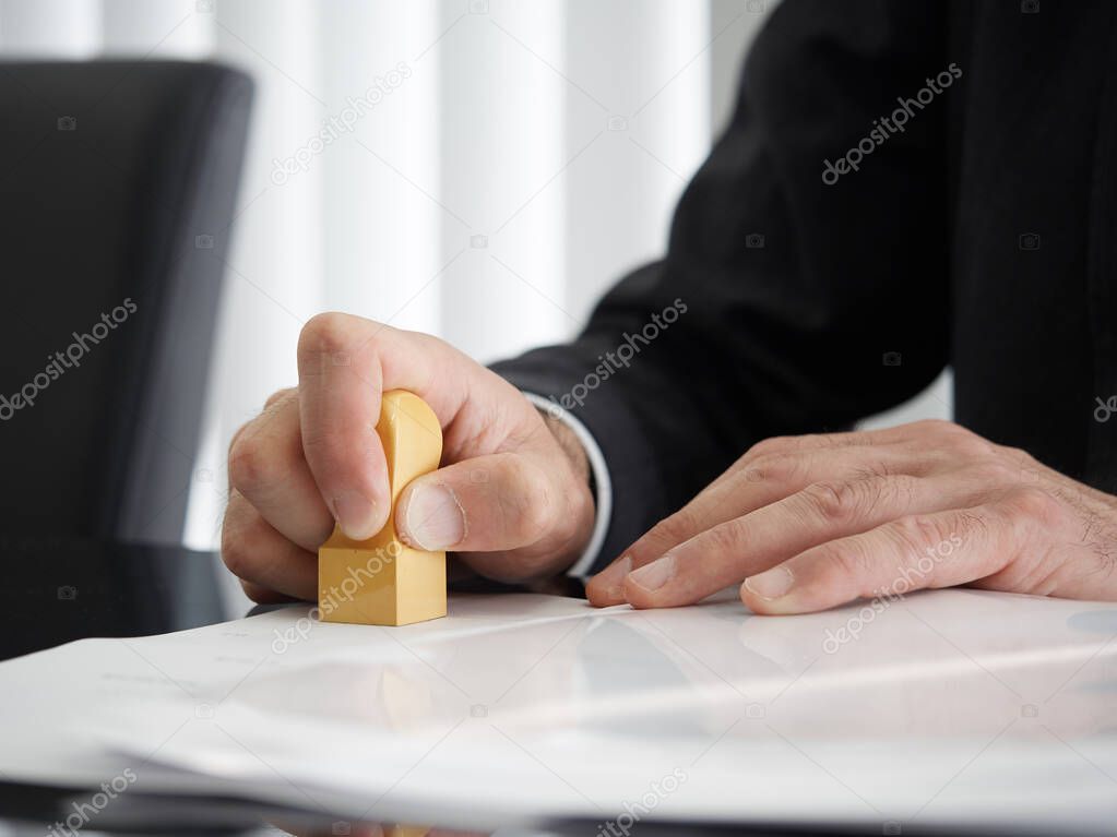 Japanese judicial scrivener pushing a square mark