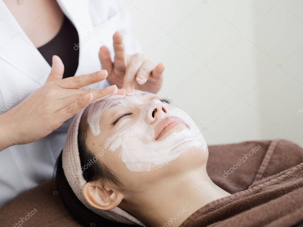 Japanese women receiving facial care