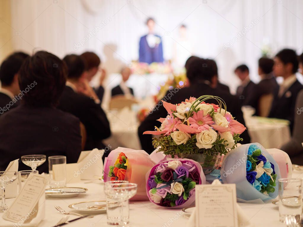 The bride and groom at a Japanese wedding reception from the friends' table