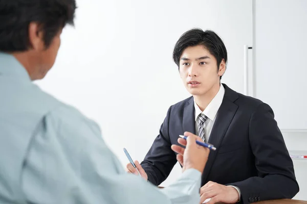 Japanese Male Salesperson Discussing Construction — Stock Photo, Image